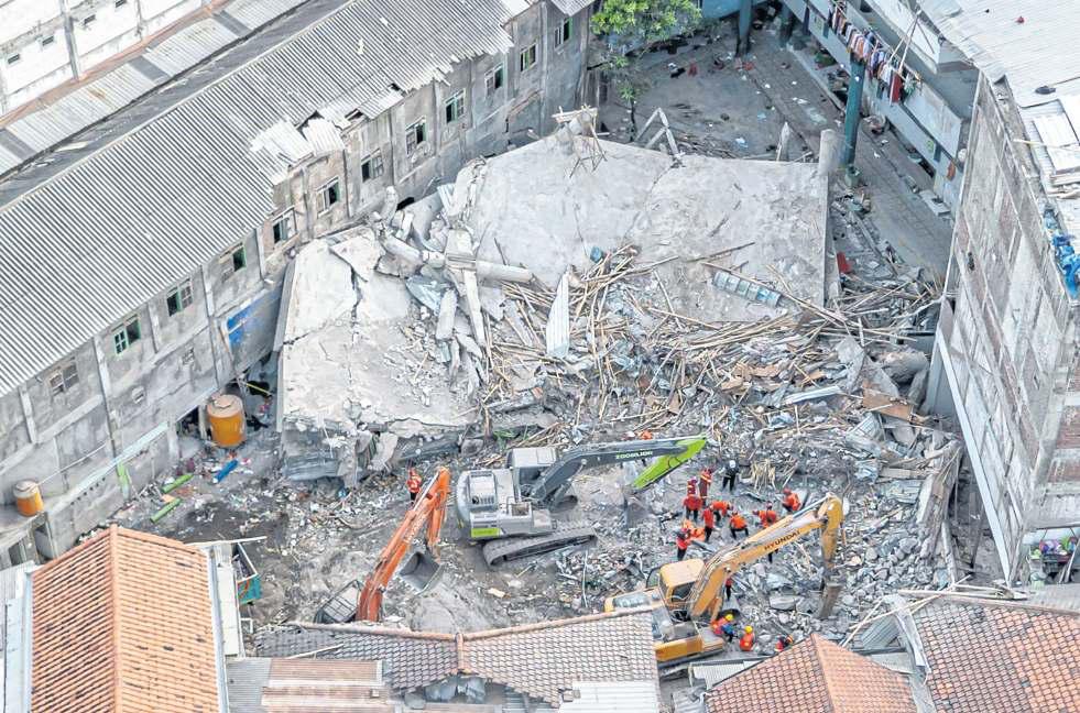 At least 50 bodies recovered after collapse