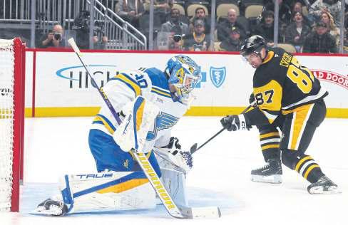 Penguins' Crosby scores 1,700th point in victory over Blues