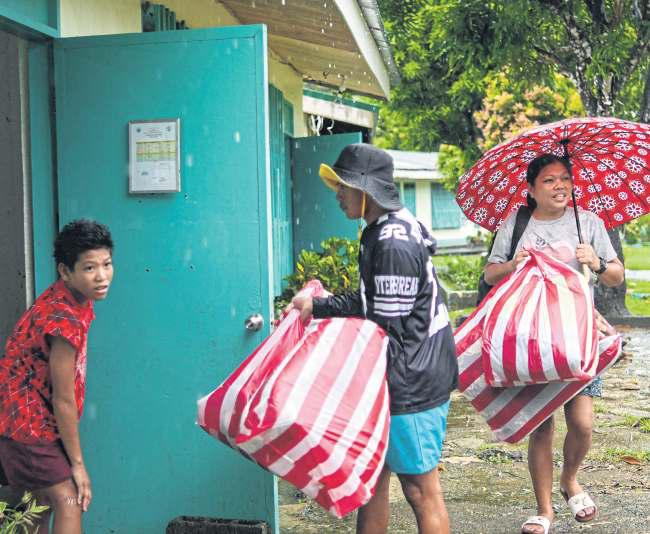 Locals evacuated as typhoon bears down