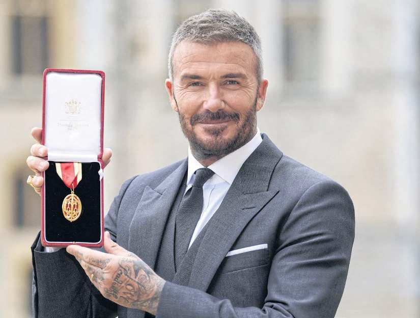 David Beckham knighted for services to sport and charity