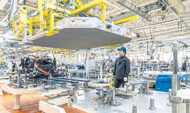 As investment slumps, China shifts