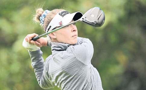 Korda defies cold and wind to grab lead