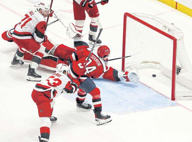 Caps write off 3-goal deficit to tame rivals Canes in OT