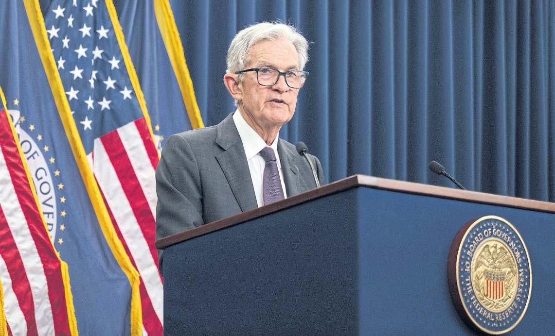 Amid war, US Fed holds rates steady