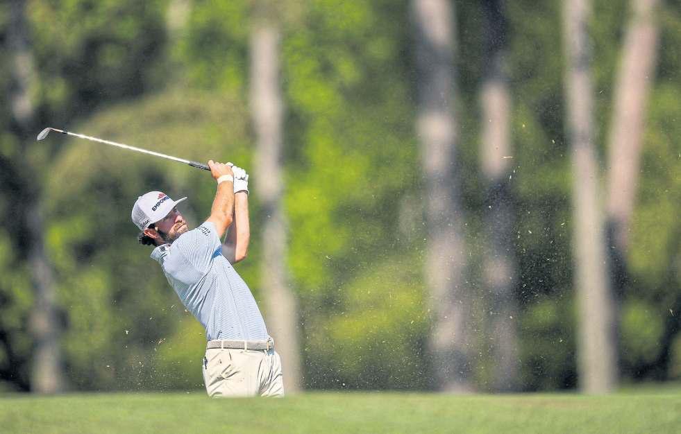 McIlroy wobbles and Young charges
