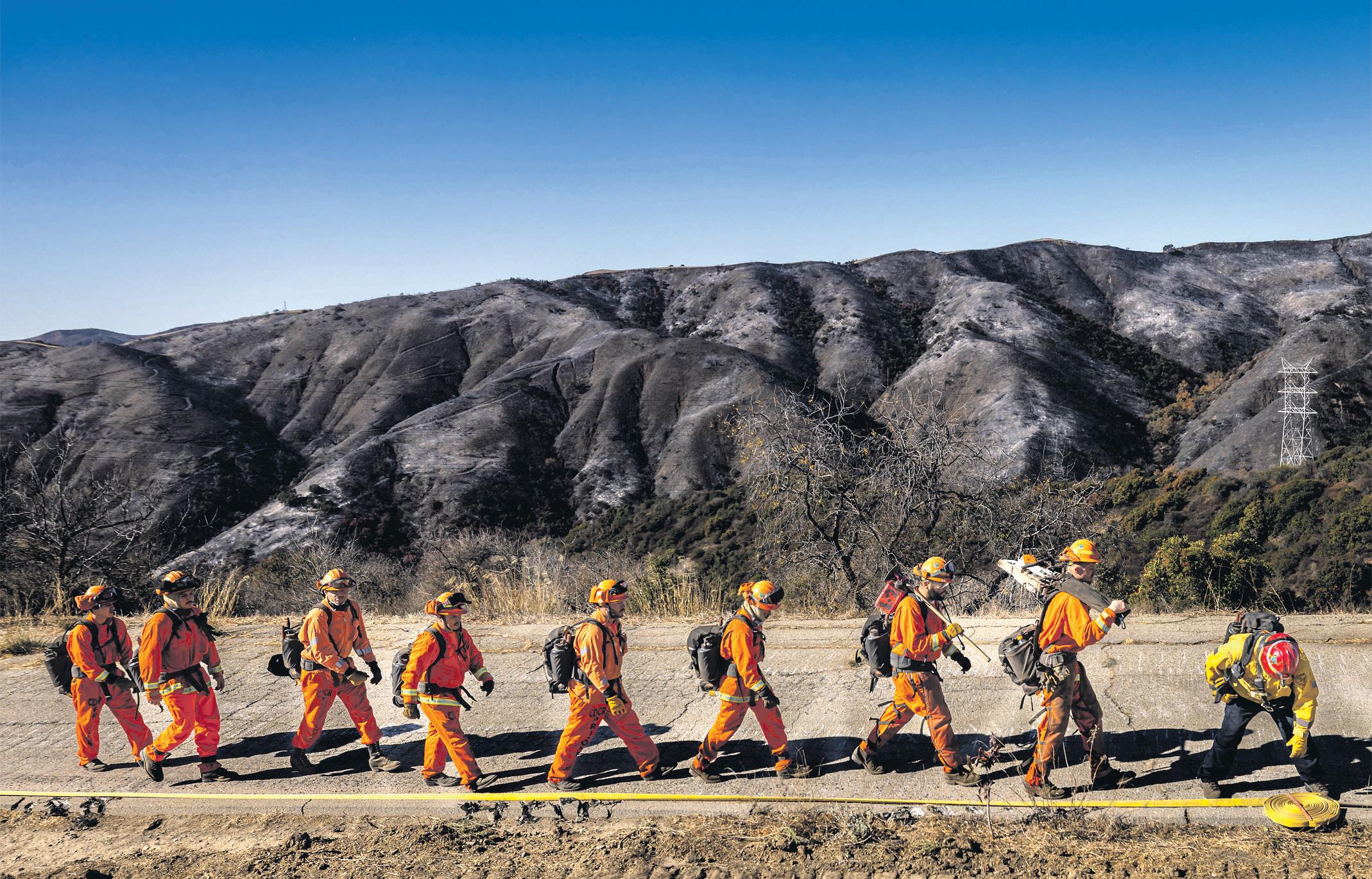 Danger not over' in LA as winds whip up fires that have killed 25