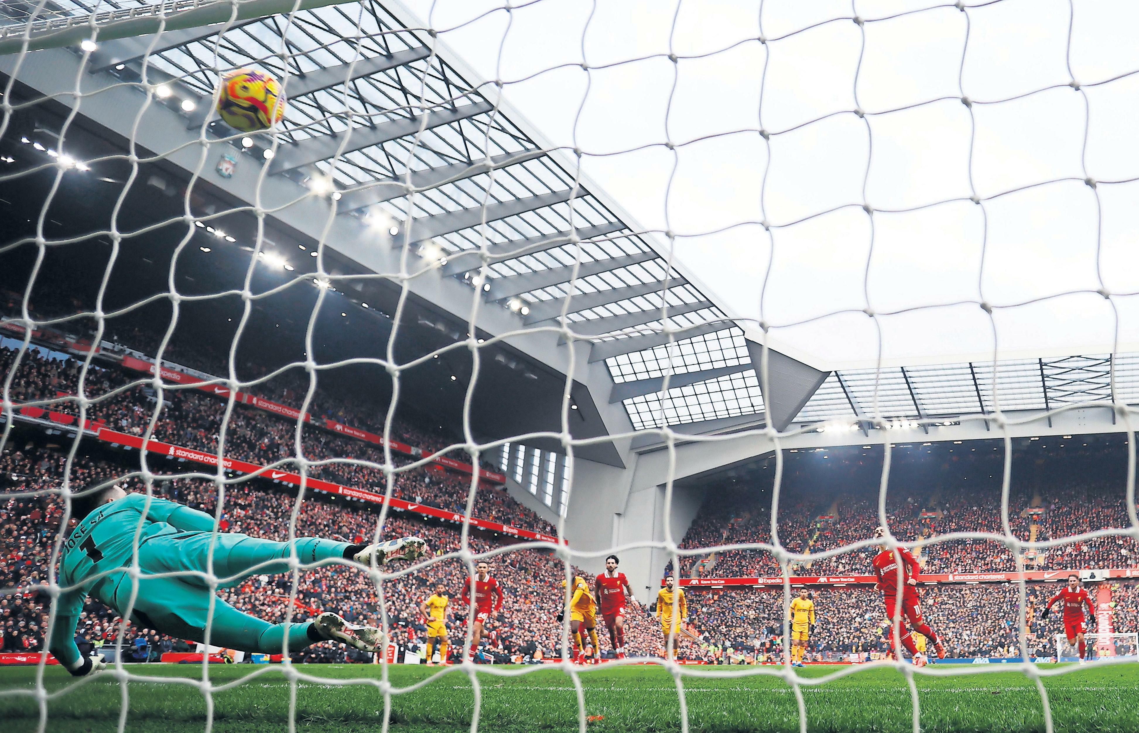 Salah on the spot before Wolves rattle Anfield's nerves
