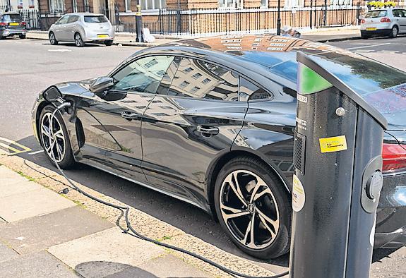 Rollout of EV charging across Britain 'patchy' and late, MPs say