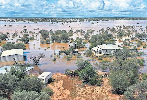 Man swept away as Australian communities cut off by floods