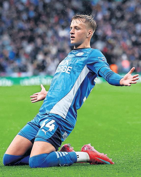 Mills sparks Posh's shock triumph at expense of second City