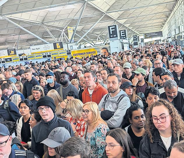 Long queues and flight delays at Stansted airport after 'IT issue'