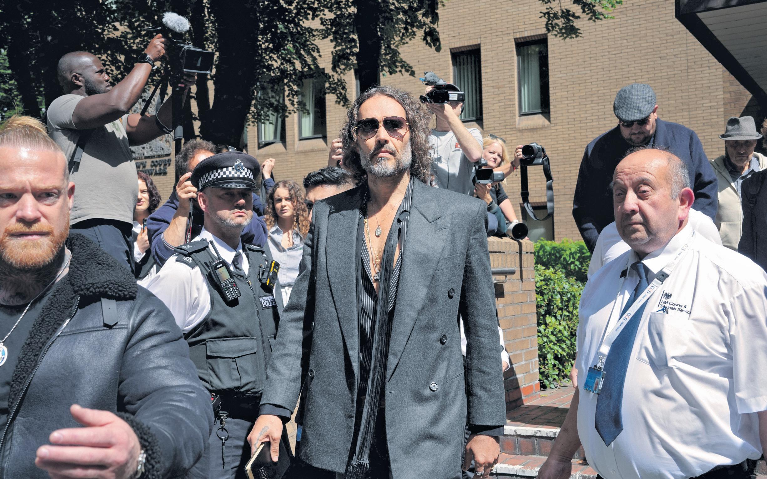 Russell Brand pleads not guilty to rape charge