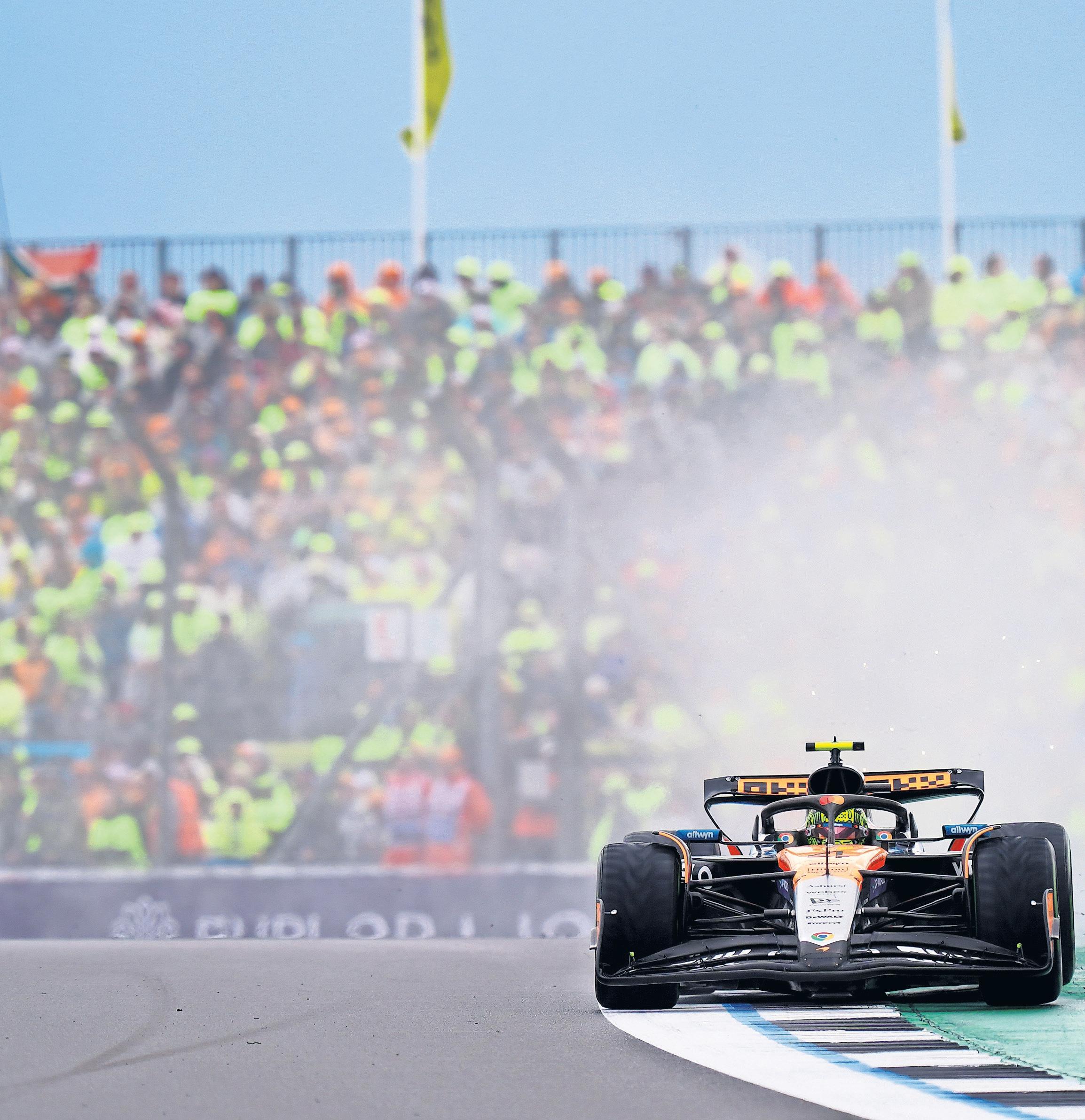 Norris navigates Silverstone spray to claim coveted prize