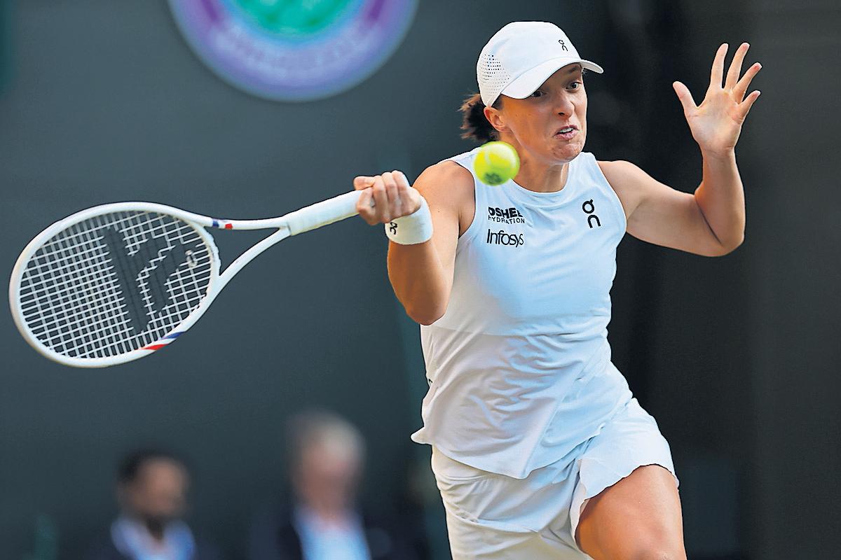 Swiatek finds feet on grass to end Tauson challenge