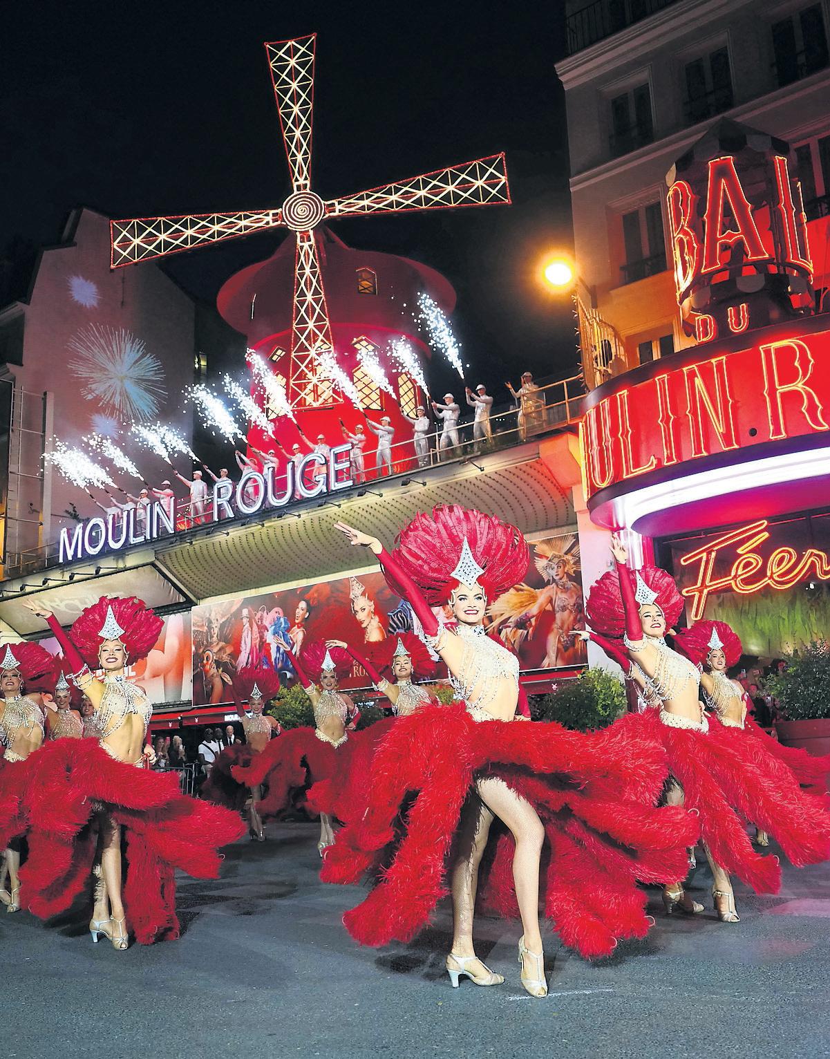Can-can dancers kick off party as sails turn again at Moulin Rouge