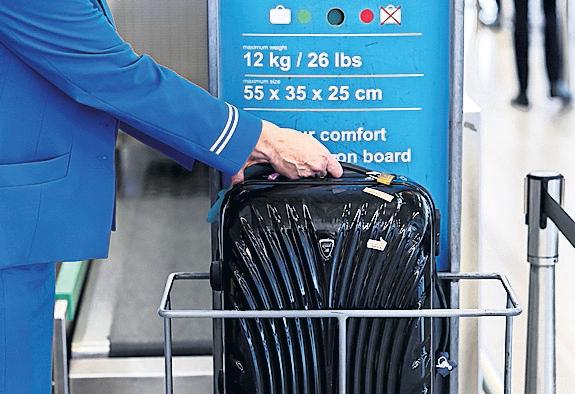 Ryanair weighs up raising bonus for staff catching oversized bags