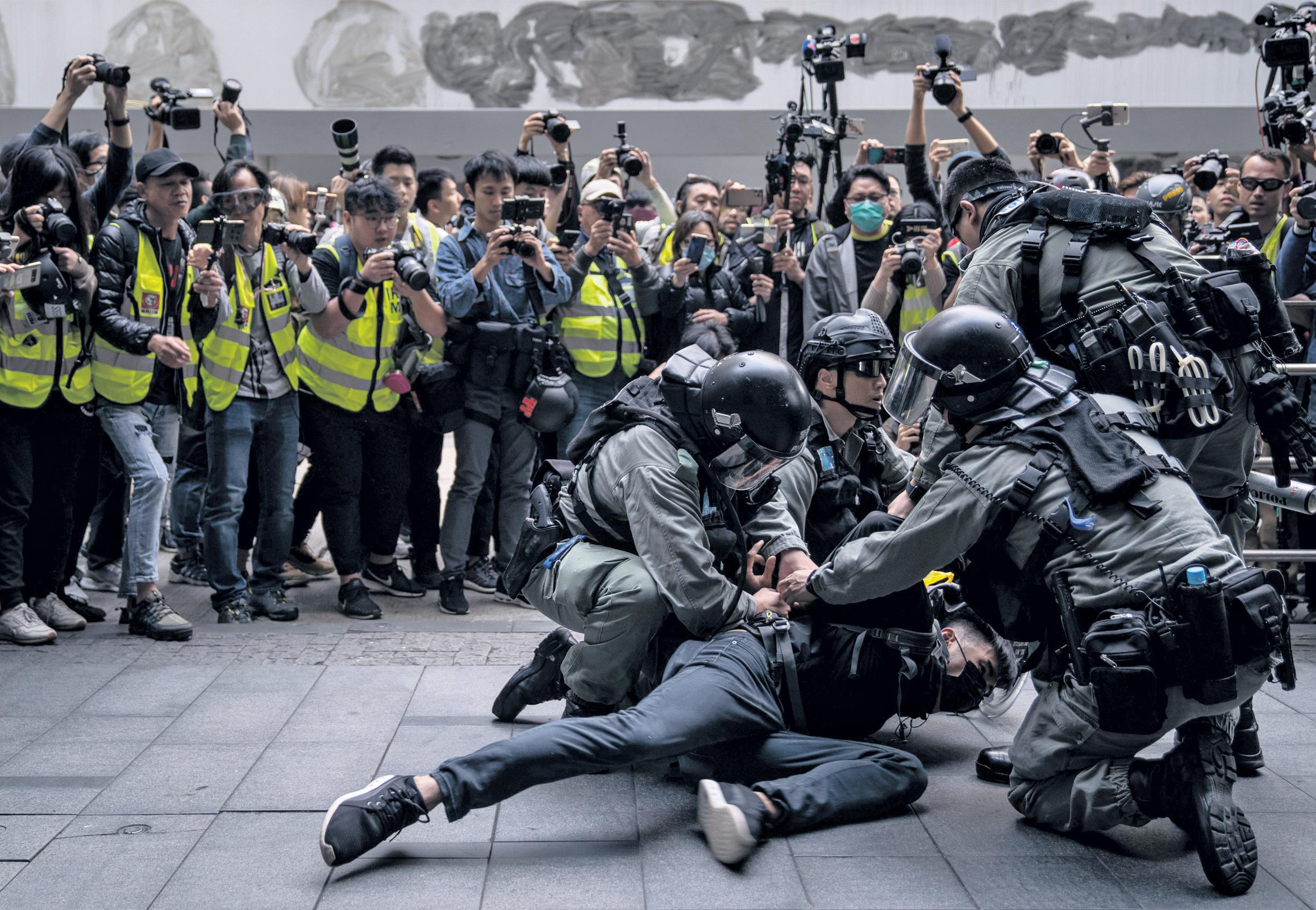 Hong Kong activist says British police asked her to 'self-censor' in face of threats from Beijing