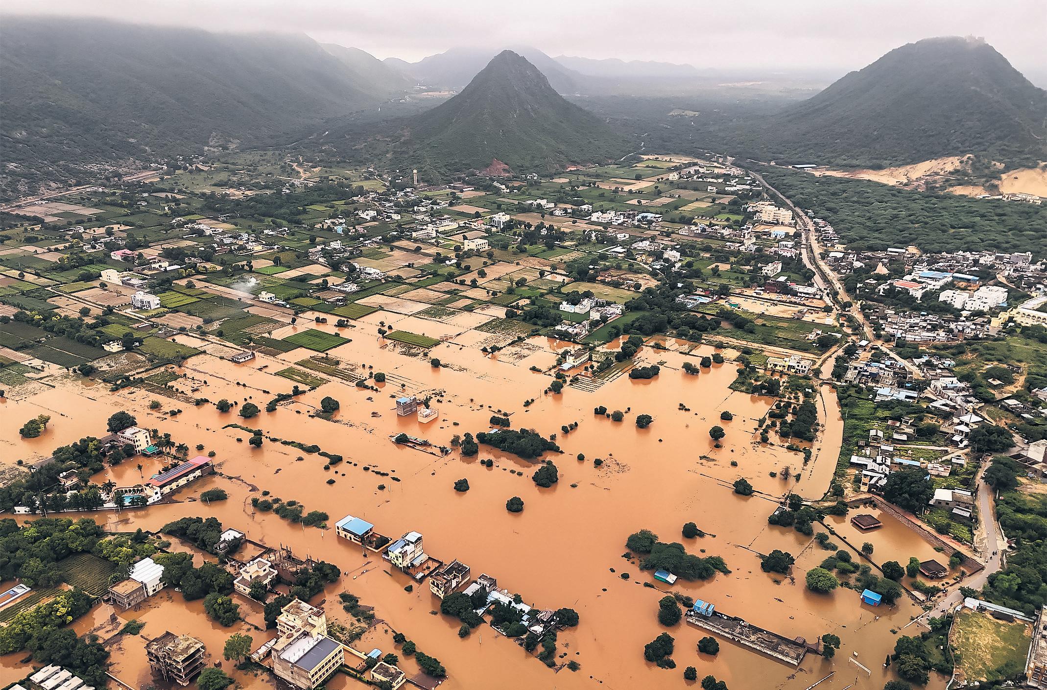 Five dead and dozens missing as 'cloudburst' flood hits town
