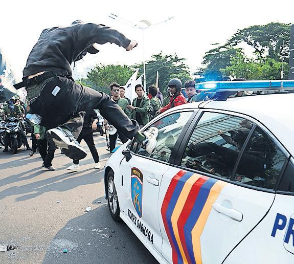 Death of man hit by police vehicle leads to protests in Jakarta