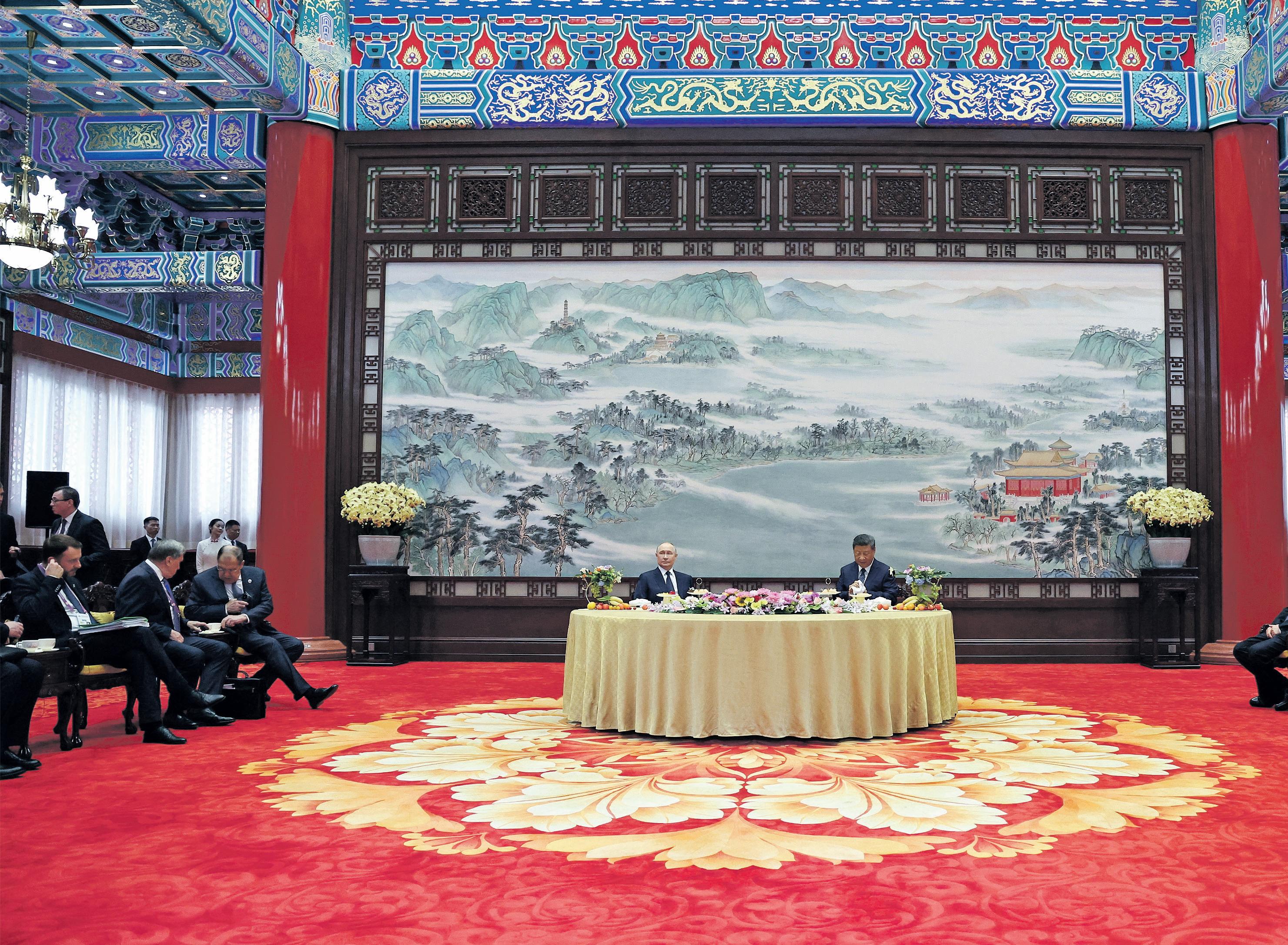 Putin hails ties with China as autocrats arrive in Beijing for show of military might
