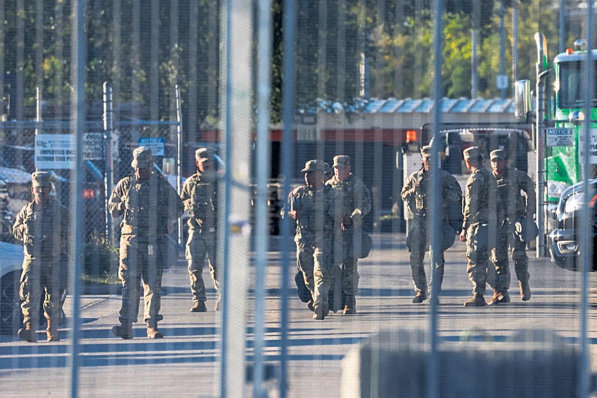 National guard deploys in Chicago as officials ask federal judge to declare operation illegal