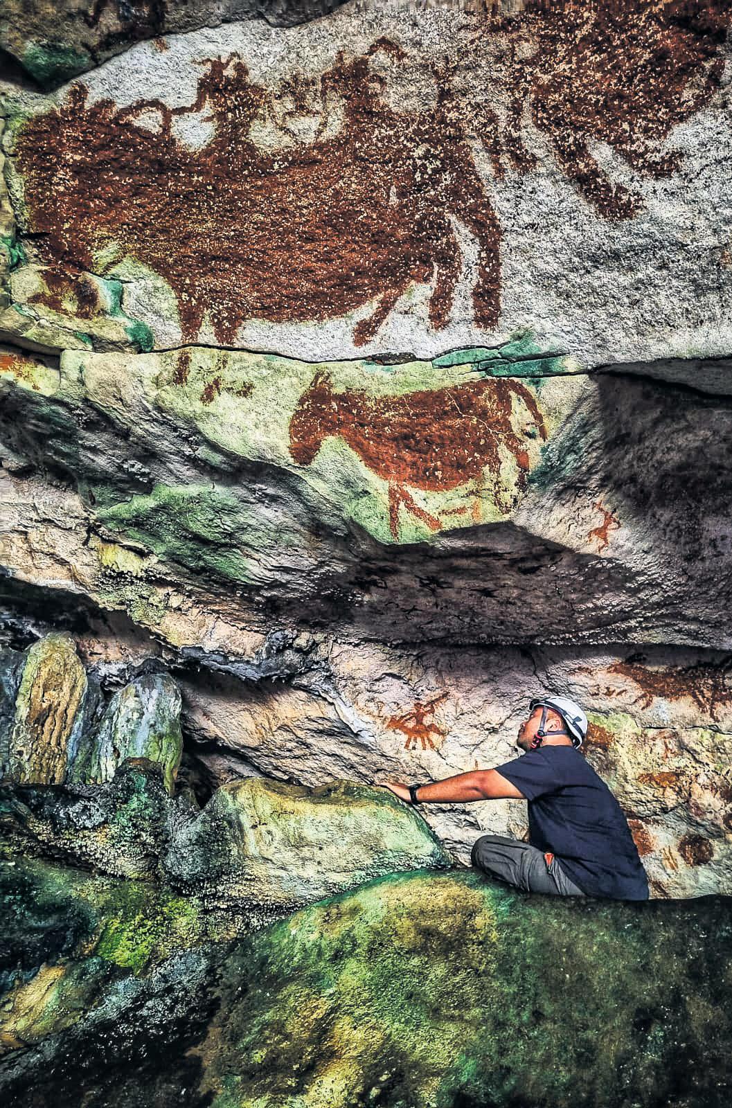 Hand print made in cave 67,800 years ago could be world’s oldest rock painting