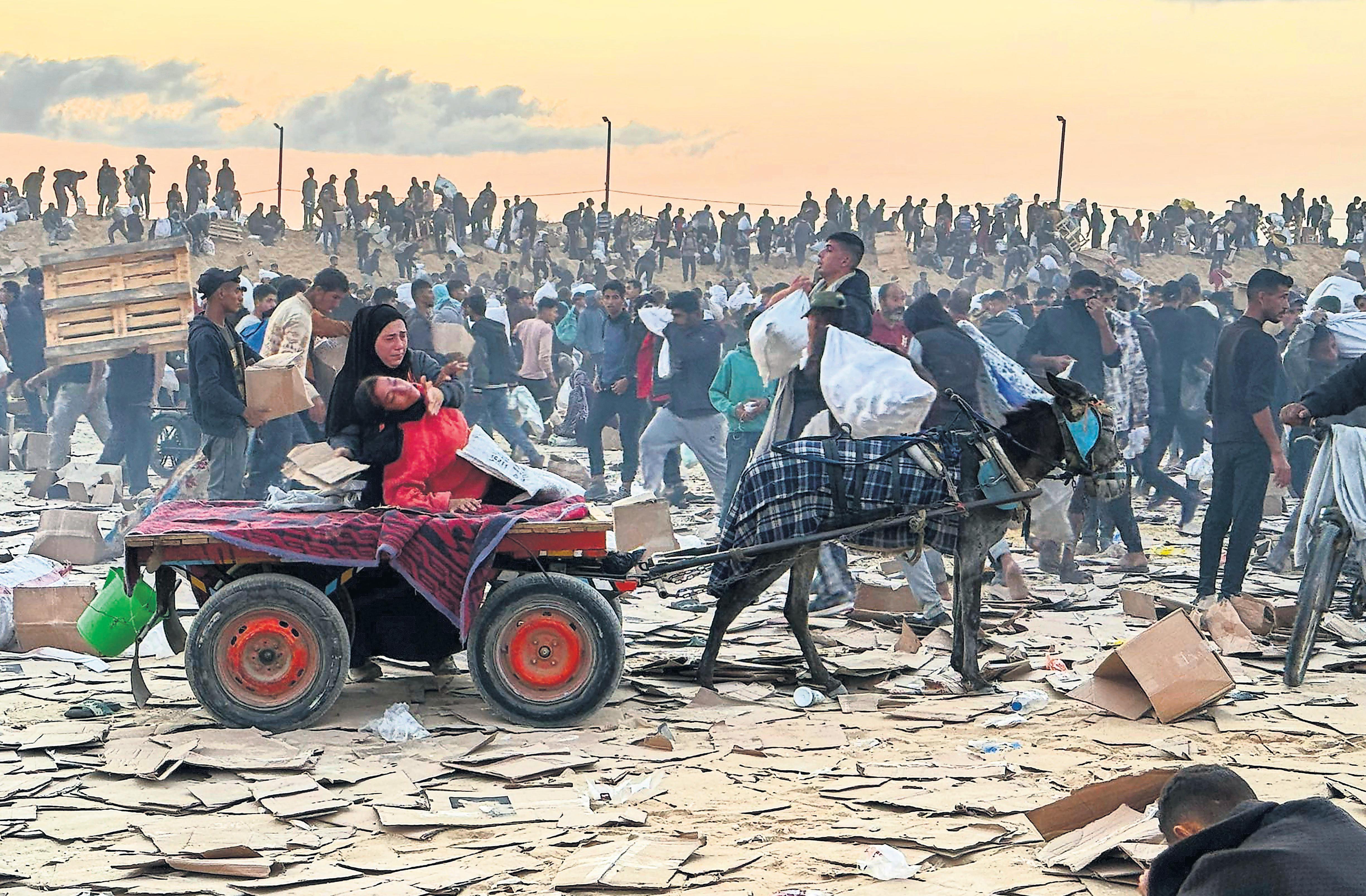 'Damn, boy, I think you got one': inside Gaza's deadly aid distribution centres