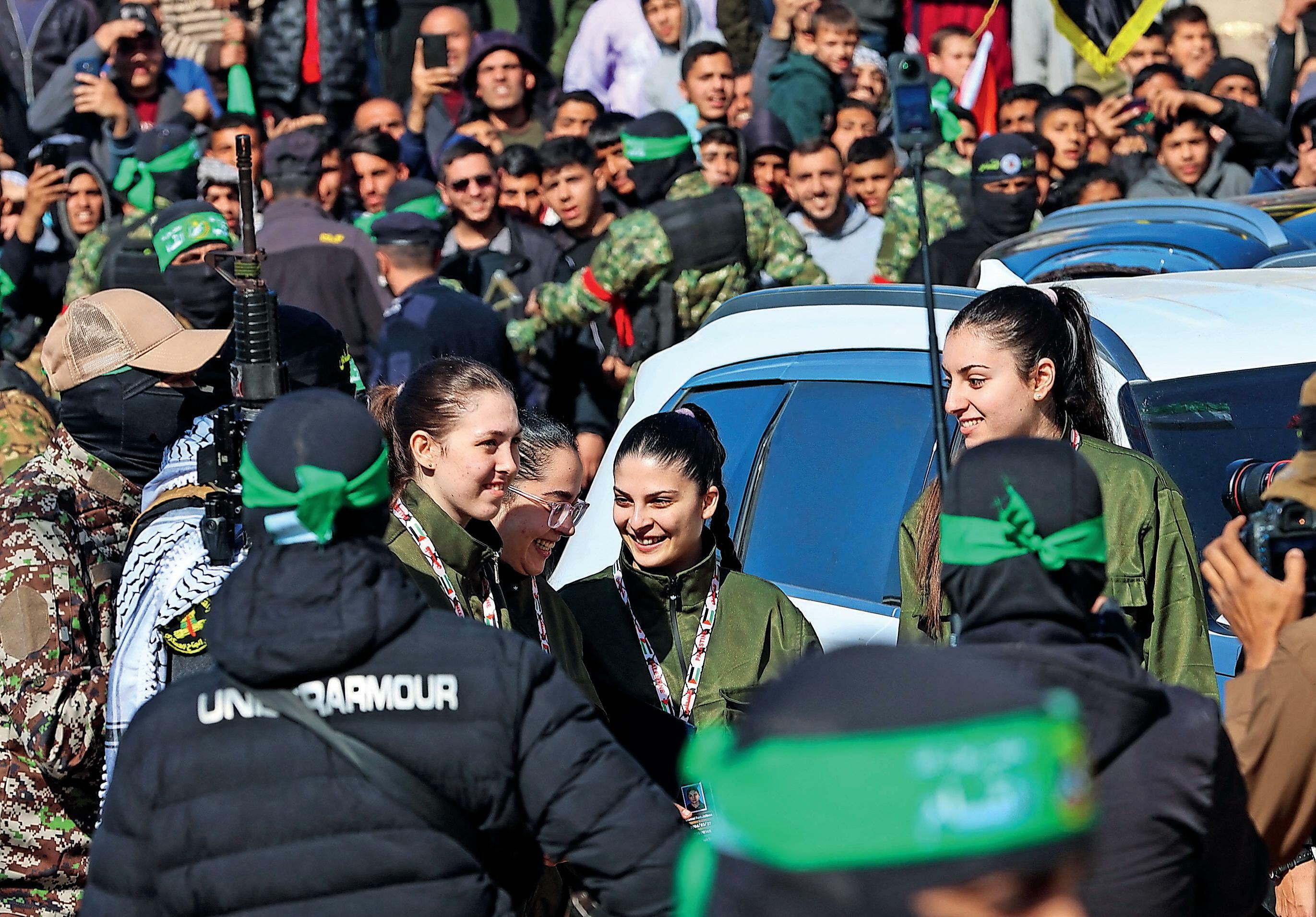I just want to hug those girls' Bittersweet joy and relief as freed soldiers return home