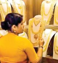 Gold dips by Rs 200, silver rebounds