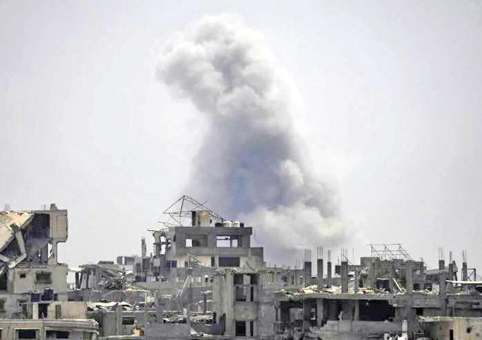 Dozens of Palestinians killed by Israeli fire in Gaza, officials say