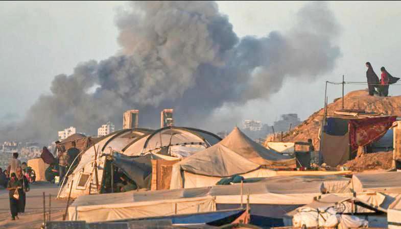 ISRAELI STRIKES KILL DOZENS IN GAZA AS HAMAS WEIGHS PEACE PLAN