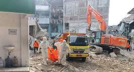 Indonesian rescuers search for missing students after school collapse kills 40