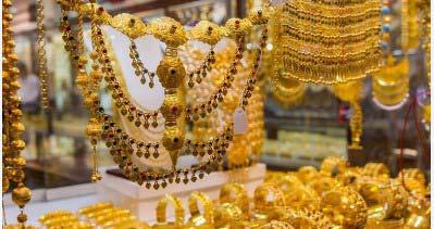 Gold may consolidate for 3rd week as traders track US data, tariff hearing