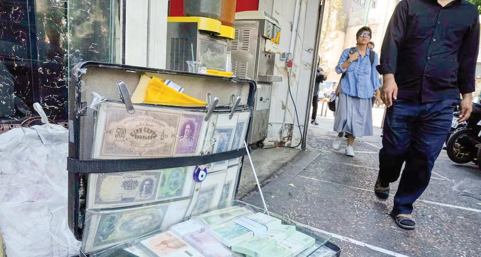 Iran’s currency falls to a new low as nuclear sanctions squeeze its ailing economy