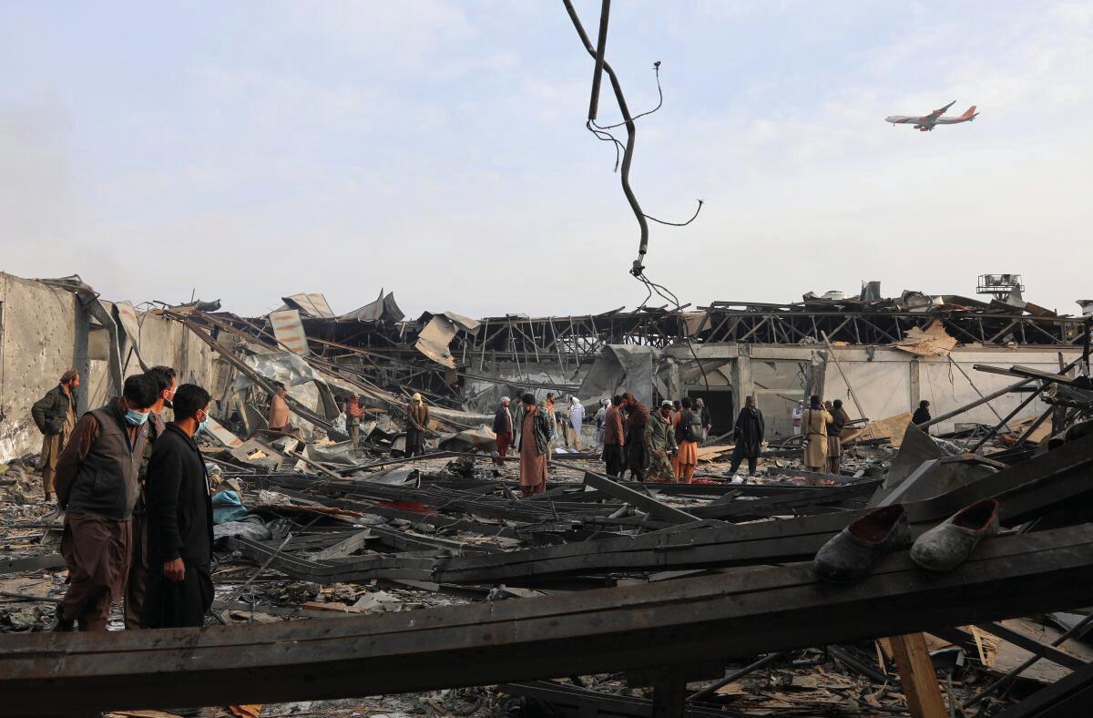 RESCUERS DIG BODIES FROM RUINS OF KABUL HOSPITAL