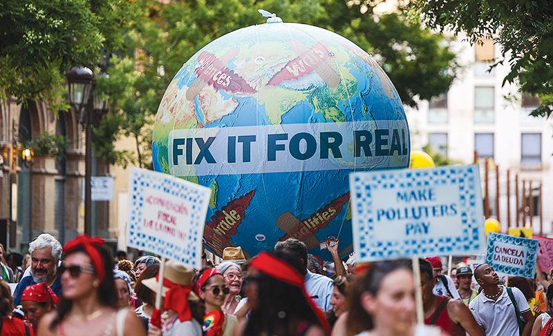 Protesters demand debt cancellation, climate action ahead of UN summit