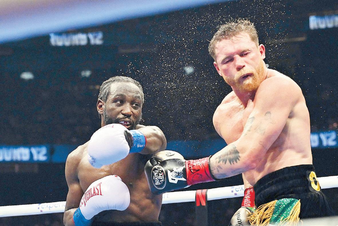 Crawford Stuns Alvarez Before 70,482 Fans