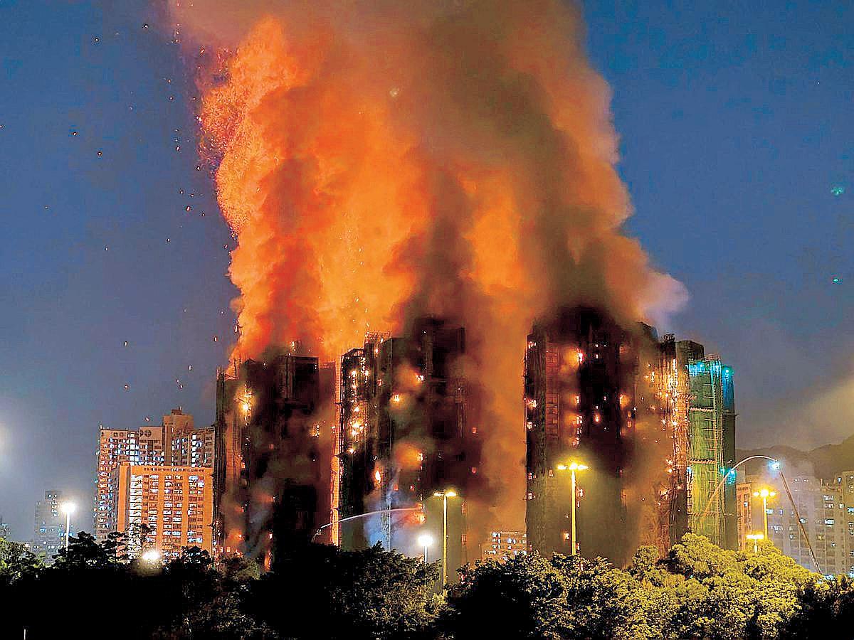 Fire engulfs Hong Kong residential blocks, killing four