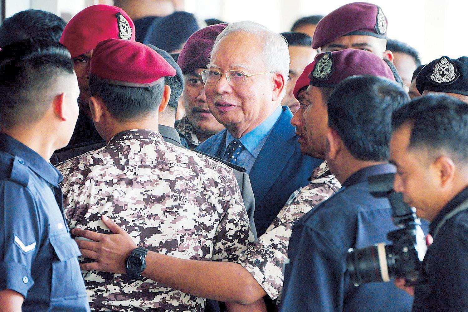 Malaysian ex-PM gets 15 years, hefty fine in 1MDB trial | The ...