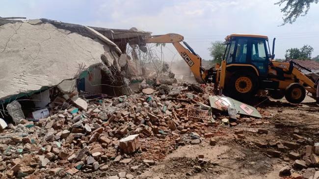 Eleven homes are bulldozed in India after beef was found