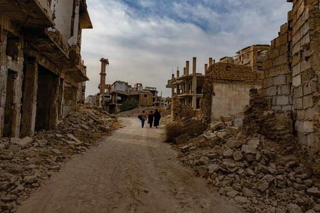 Syrians vow to rebuild their town after Assad's brutality