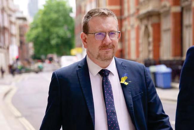 Health minister sacked over 'racist' WhatsApp messages