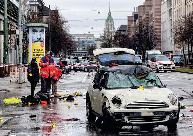 Afghan asylum seeker held after car driven into protest