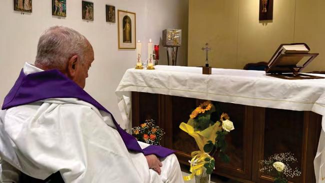 Vatican releases picture of Francis praying in hospital