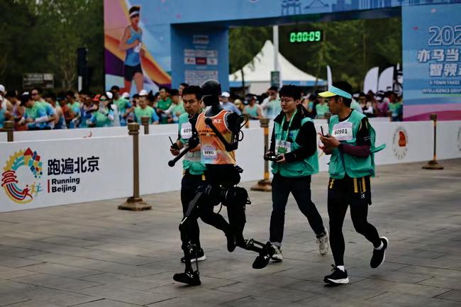 Robots race humans in a half-marathon for first time