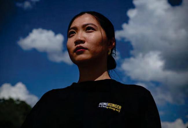 Hong Kong police arrest family of wanted activist