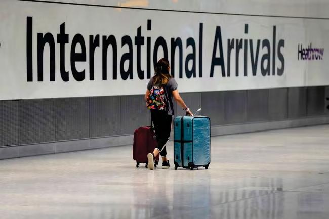 Net migration almost halves after tough visa rules kick in