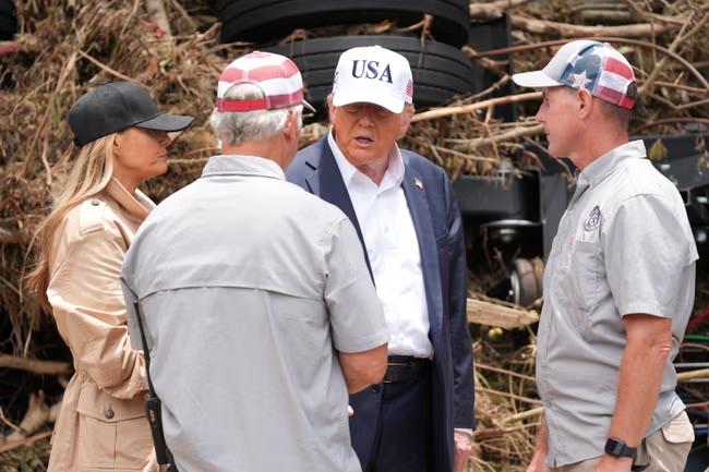 Trump defends state flood response as he visits Texas