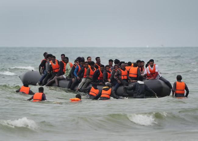 First migrants held under returns deal with France