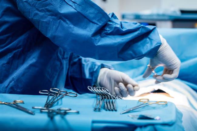 Doctor is struck off after posting live brain surgery picture on dating website